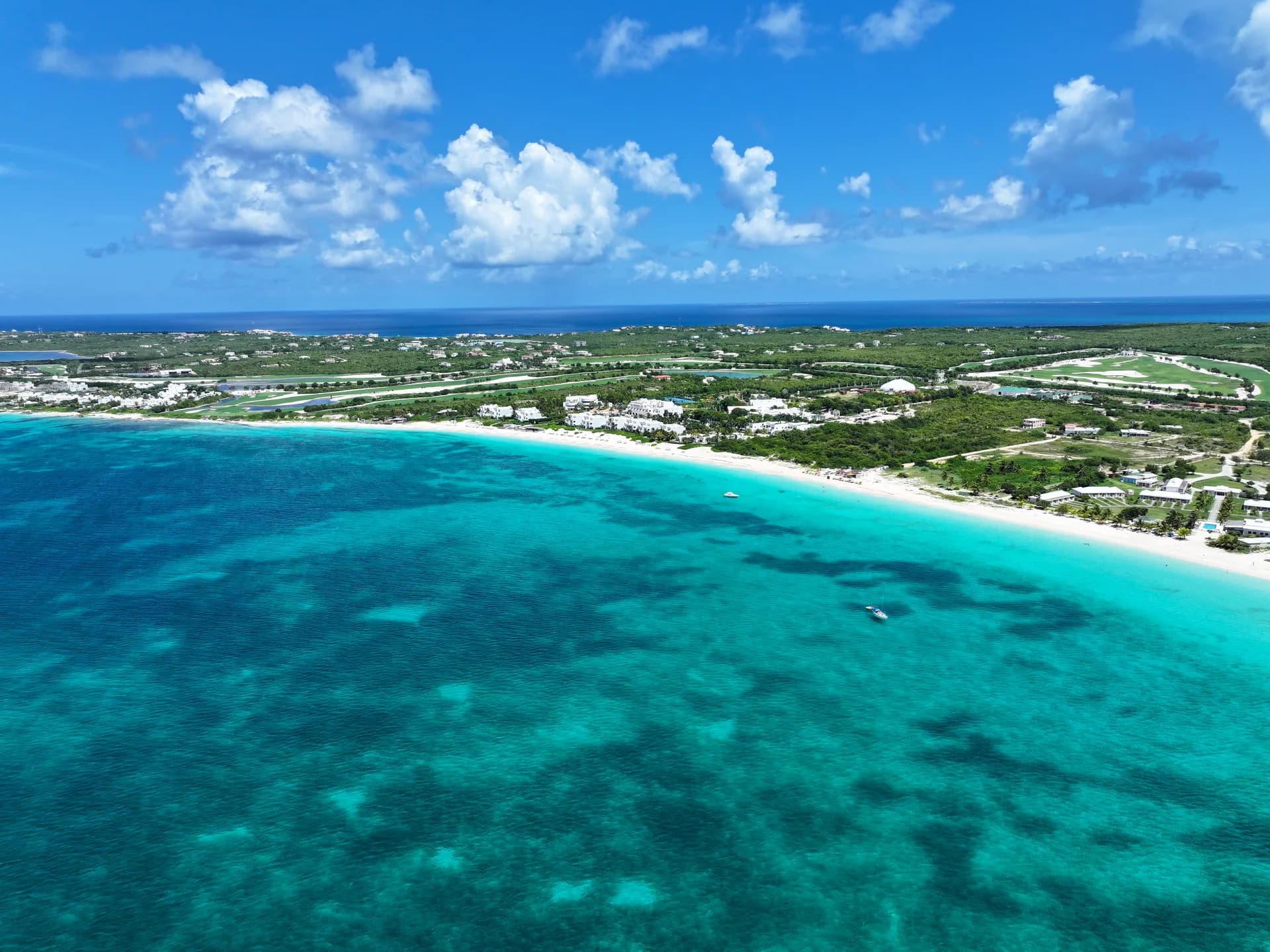 Aerial view along the white sand of Rendezvous Bay