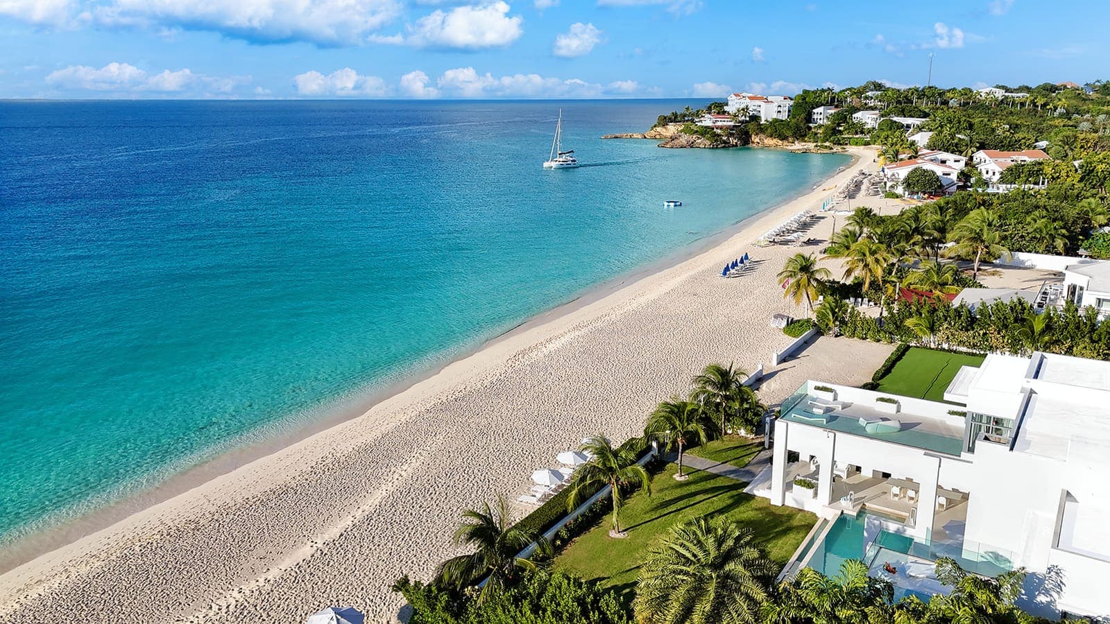 Meads Bay beach and its turquoise shoreline from above